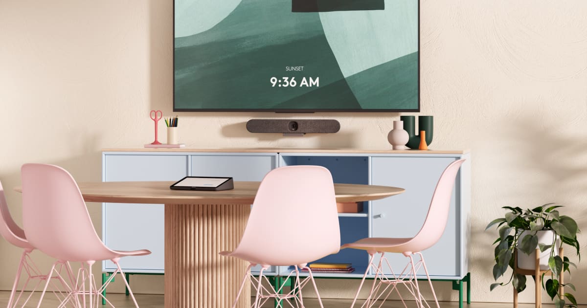 Logitech Rally Bar meeting room with wall-mounted display and Tap controller